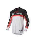 Alpinestars Crosströja Fluid Speed i svart, vitt och rött med långärmad design. Perfekt för motocross och offroad-körning.