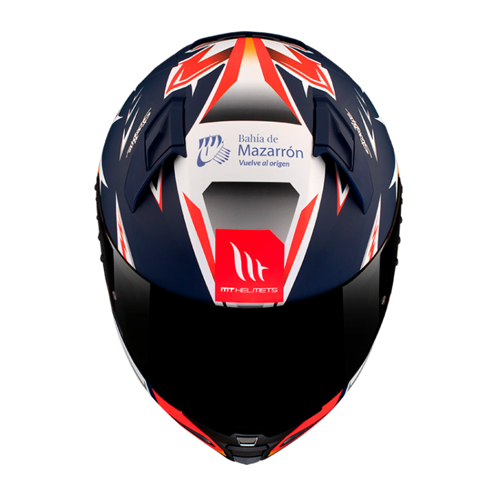 Toppen av MT Helmets Integral Mc-Hjälm Revenge 2 Acosta Blå med Bahía de Mazarrón-logotyp och skarpa grafiska linjer i blått, rött och vitt.